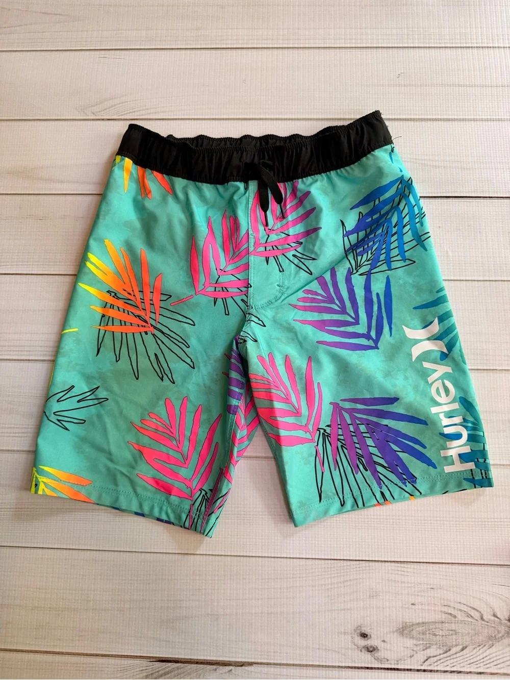 Lot of kids swim trunks and tops